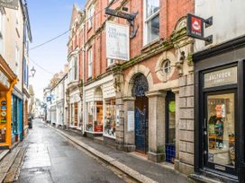 A street view showing shops and buildings at Lil Nauti in Fowey