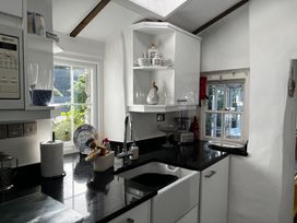 A kitchen with a sink and countertop at Bwthyn Nain