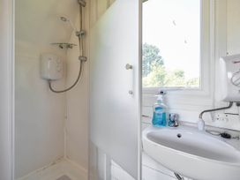 A shower with a sink in a bathroom at St Austell Glamping in St Austell