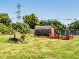 An outdoor area with a yurt, fencing, and power lines at St Austell Glamping in St Austell