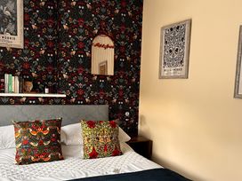 A bedroom with a bed and decorative pillows at the property