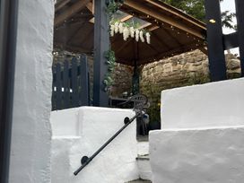 A garden view with a gazebo and stairs at The Old Barn in Manchester