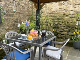 A table with breakfast items in a garden at the property in location