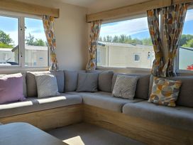 A living room with seating area at Caravan