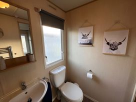 A bathroom with a sink and toilet at The Old Barn in Manchester