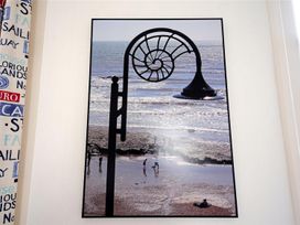 A photo of a beach scene with a snail shell design at 1 The Old Posthouse, Lyme Regis