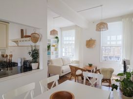 A living room with a sofa and coffee table at 1 The Old Posthouse Lyme Regis
