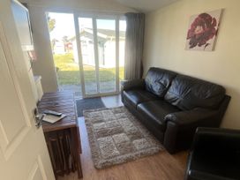 A living room with a sofa and coffee table at Embury