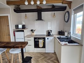 A kitchen with appliances and a work surface at 38A in Bridlington