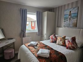 A bedroom with a bed and window at 38A in Bridlington