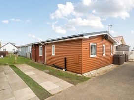 An outdoor view of houses and pathway at 38A in Bridlington