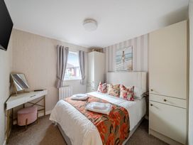 A bedroom with a bed and wardrobe at 38A Bridlington