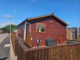 An outdoor area with a house and garden furniture at 311 Bridlington