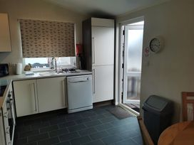 A kitchen with a sink and refrigerator at 311 in Bridlington