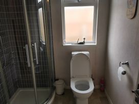 A bathroom featuring a shower and toilet at 311 Bridlington