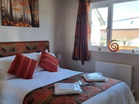 A bedroom with a bed and window at 50 Bridlington