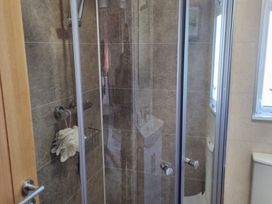 A shower cubicle with a towel in a bathroom at 50 in Bridlington