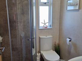 A bathroom with a shower and a toilet at 50 Bridlington