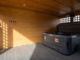 An indoor space with a hot tub and wooden walls at The Galloway in Morpeth