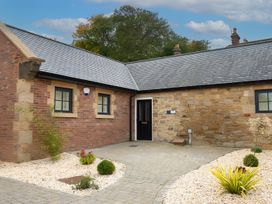 A building exterior with a door and windows at The Shearling in Morpeth