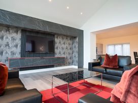 A living room with a television and coffee table at The Shearling in Morpeth