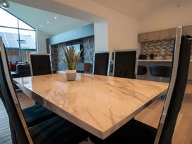 A dining room with a marble table and chairs at The Shearling in Morpeth