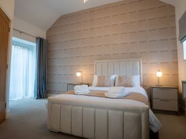 A bedroom with a bed and bedside tables at The Shearling in Morpeth