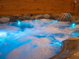 A hot tub with bubbling water and LED lights at The Shearling in Morpeth