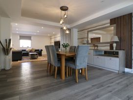 A dining room with a table and chairs at The Newland in Morpeth