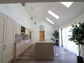 A kitchen with cabinets and a countertop at The Newland in Morpeth