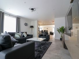 A living room with sofa and coffee table at The Gavel in Morpeth