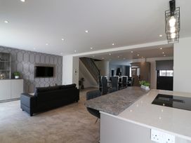 A living room with a sofa and television at The Gavel in Morpeth