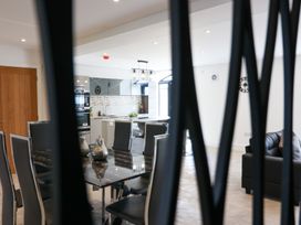 A kitchen and dining area with modern furniture at The Gavel in Morpeth