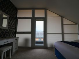A bedroom with a desk and mirror at The Gavel in Morpeth