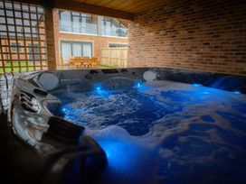 A hot tub with bubbling water and lights at The Gavel in Morpeth