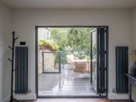 An indoor view of a deck with furniture at Honeysuckle Lodge in Knaresborough