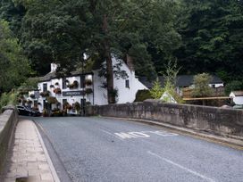 A street view of a building with a sign on the road at Another Shipton Inn in Knaresborough