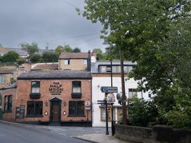 A pub with a sign on the street at The Half Moon in Knaresborough