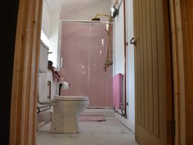 A bathroom with a toilet and a shower at Ty Llaeth in Carmarthen