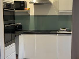 A kitchen with appliances and countertops at Edal Court in Sheringham