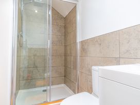 A bathroom with a shower and toilet at Groeslon Uchaf in Caernarfon