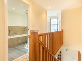 A bathroom with a bathtub and shower at Groeslon Uchaf Caernarfon