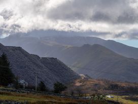 A landscape with mountains and a road at Groeslon Uchaf Caernarfon