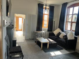 A living room with a sofa and coffee table at 4 Bickington Road in Barnstaple