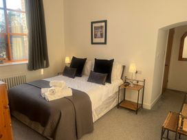 A bedroom with a bed and bedside table at 4 Bickington Road in Barnstaple