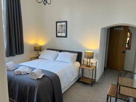 A bedroom with a bed and nightstand at 4 Bickington Road Barnstaple