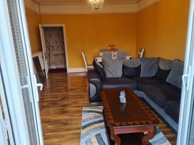 A living room with a sofa and coffee table at Sea View Escape in Penmaenmawr