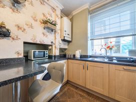 A kitchen with a countertop and microwave at Sea View Escape in Penmaenmawr