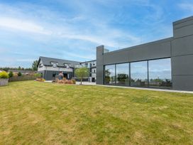 An outdoor area with a house and garden at Huxham View and Annex Stoke Canon