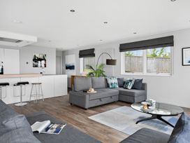 A living room with a sofa and coffee table at Huxham View and Annex Stoke Canon